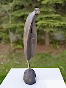 HAKAN ERASLAN tarafından 2019 yılında 55x19x11 cm ölçülerinde Zeytin Ağacı Yontu tekniği ile yapılmıştır.